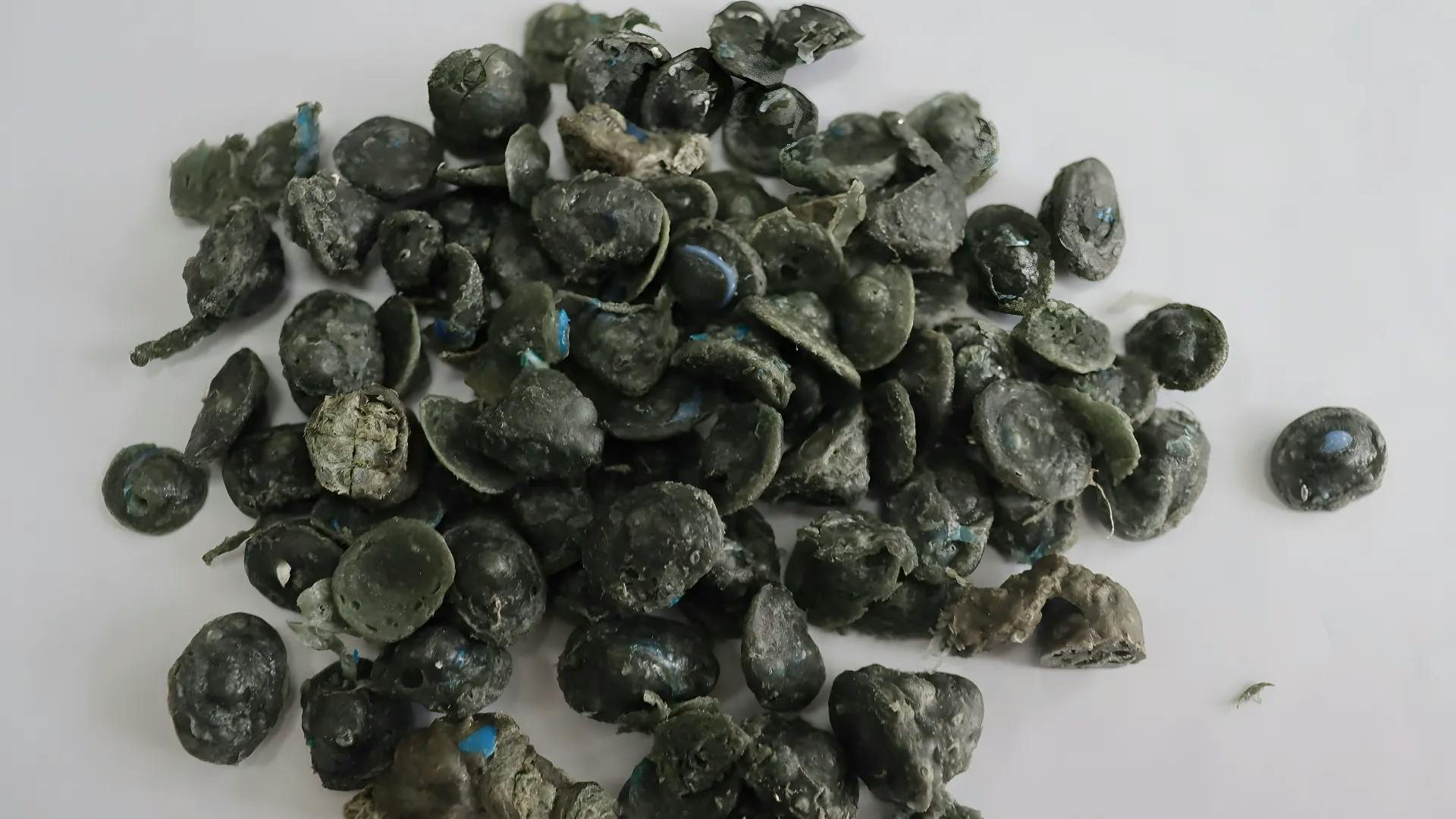 Various plastic products like pipes and pallets made from recycled pellets.